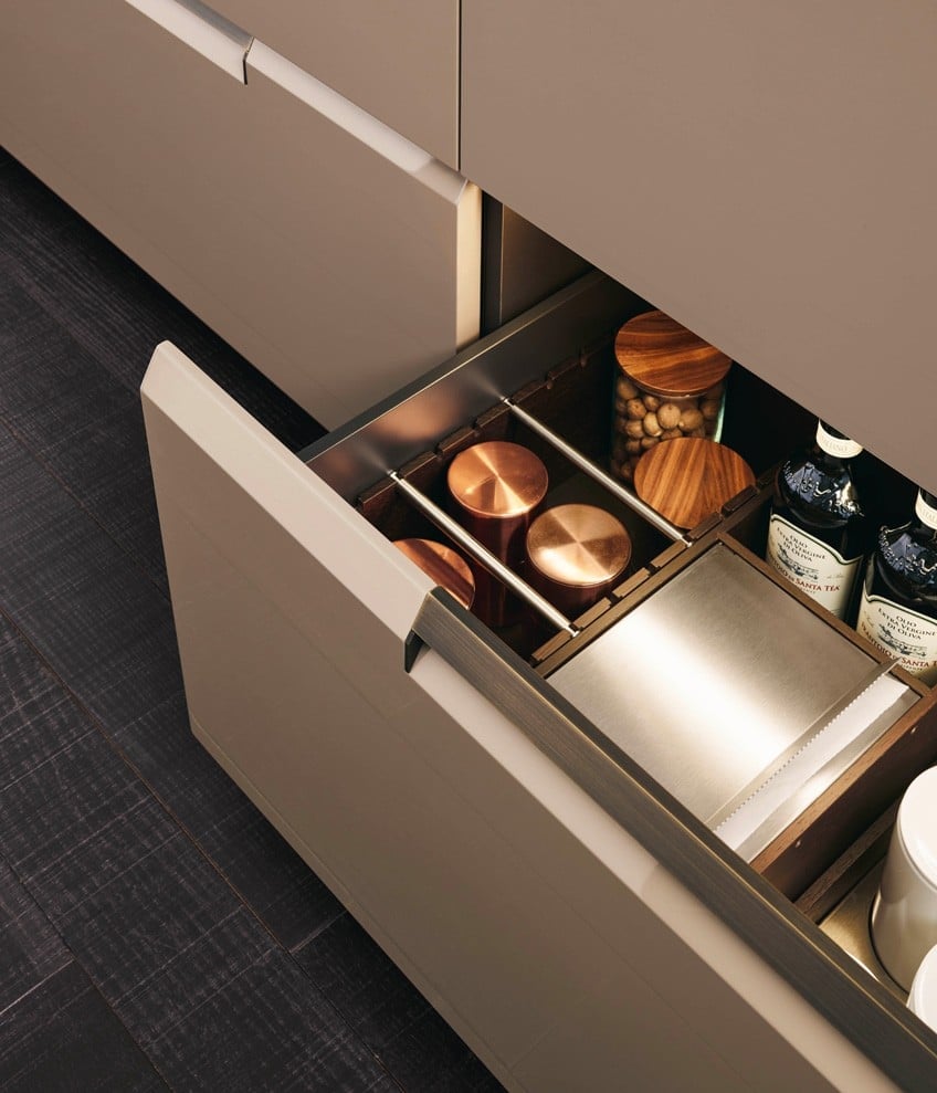 Fitted drawer with copper canisters, walnut storage boxes and oils
