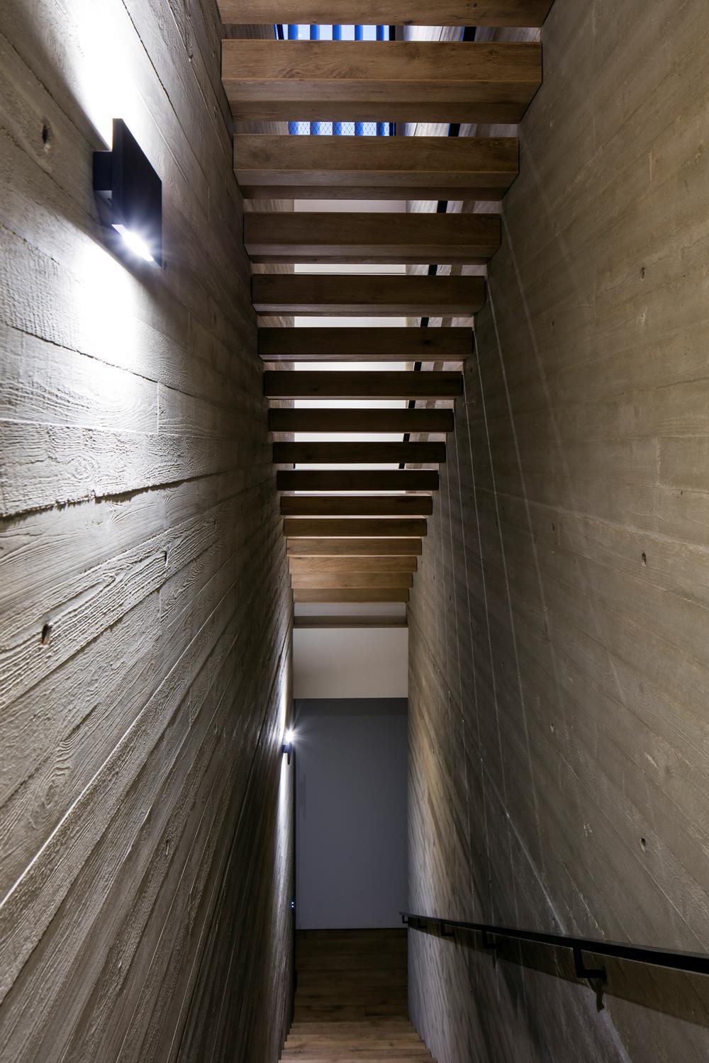 Oak staircase rising to the roof