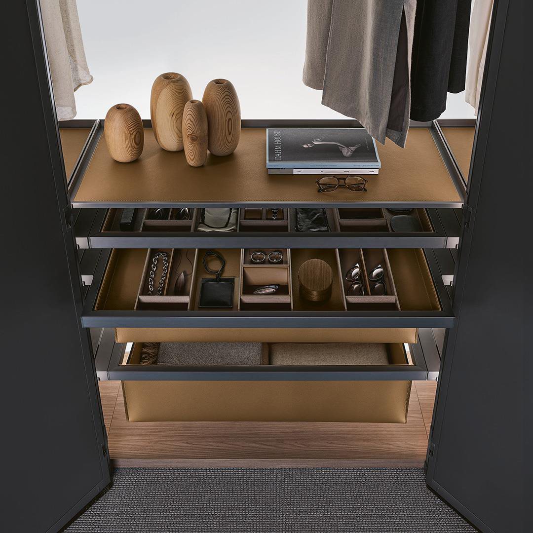 Detail of fitted wardrobe with leather-lined drawers